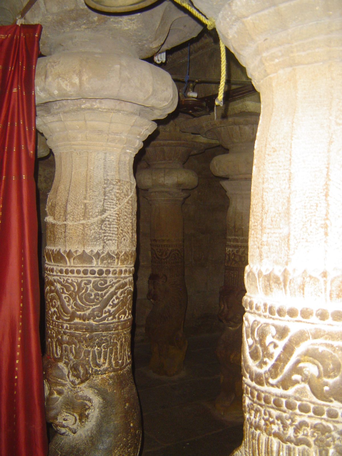 A side glimpse of the shrine, again with lion-base columns.
