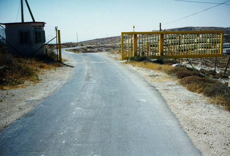 The gate to Metzad, a small settlement northeast of Hebron. The gate itself is strictly standard-issue, identical to the gates at almost eve
