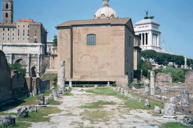 The Arch of Septimius Severus is on the left, bordering the severe brick Curia, or senate house, built by Domitian and restored by Diocletia