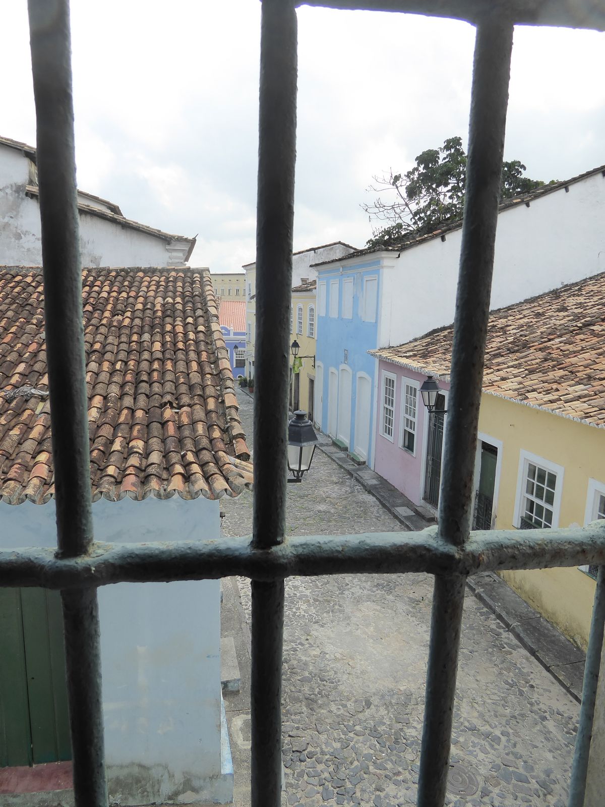 Do the bars make you feel safe or imprisoned? Either way, the lane in back of the church is picture perfect.