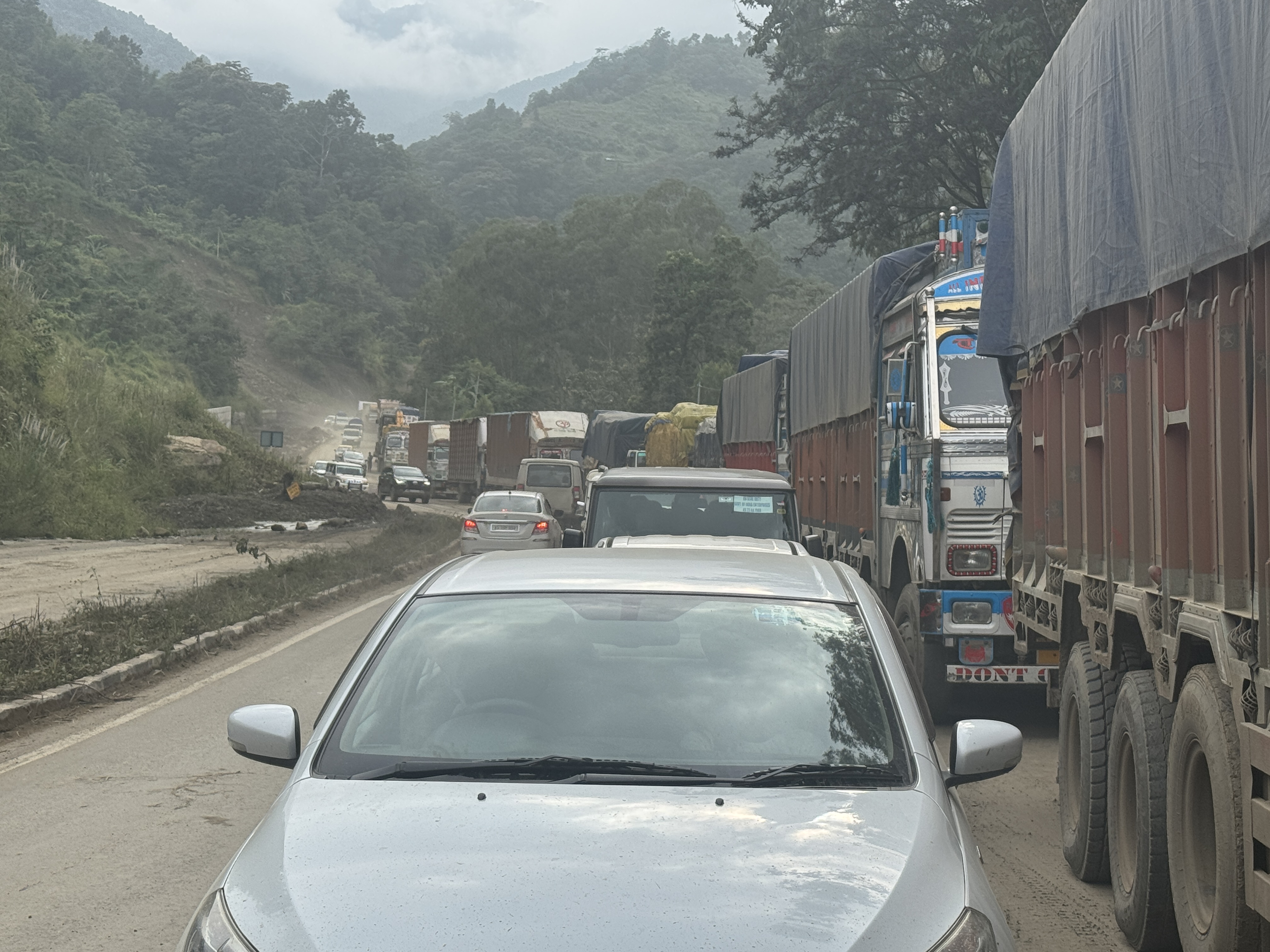 Here's a jam caused by a slide that reduced traffic to a single lane, but that's not the only reason for the jam.  Kohima traffic is so inte