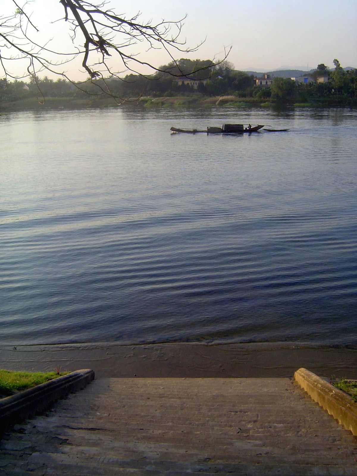 We start on the Perfume River perhaps two miles upstream from the city.