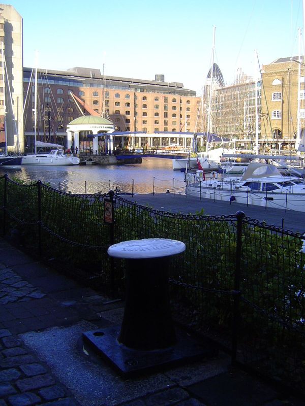 The bollard is old. The basin itself was designed by Thomas Telford, famous in other quarters as the "colossus of roads." The yachts and the