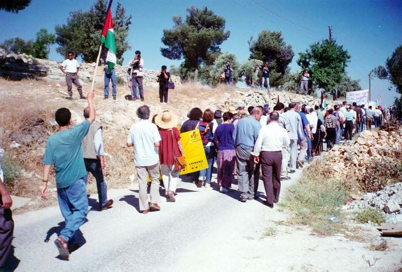 A procession sets out from Bethlehem to protest the confiscation of land for a security road on the north side of the city. Turnout was ligh