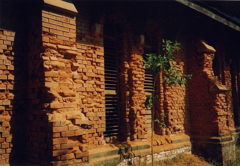 A row of dilapidated Christian churches runs along Upper Main Road.