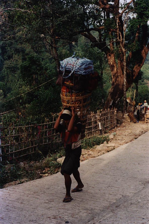 Porters carry supplies to the many shops and restaurants up top.