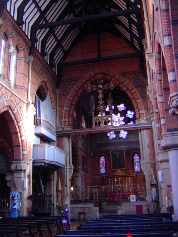 The arresting interior, mostly brick but highlighted by the alternation with black. Pevsner writes of its "Ruskinian toughness exaggerated b