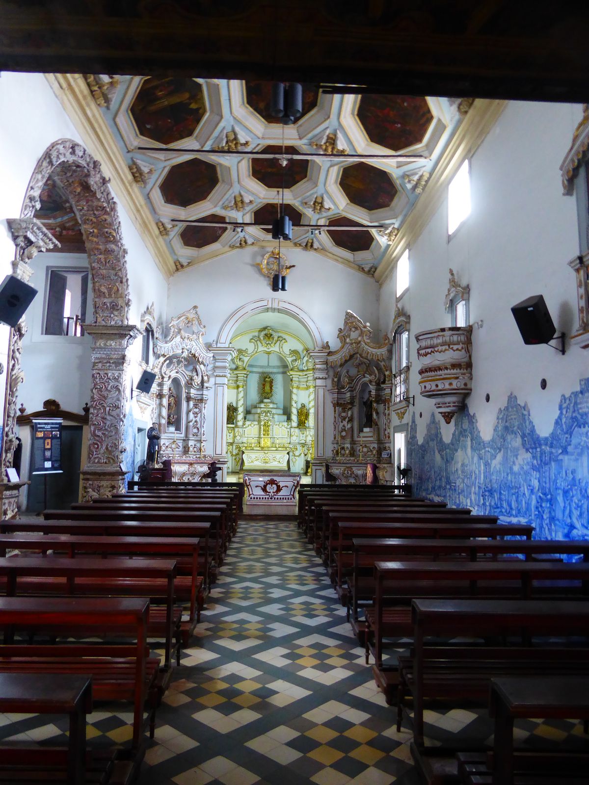 The interior of the church is walled on one side by blue tiles and marked on the other by a chapel that outguns the main church. You'll see.