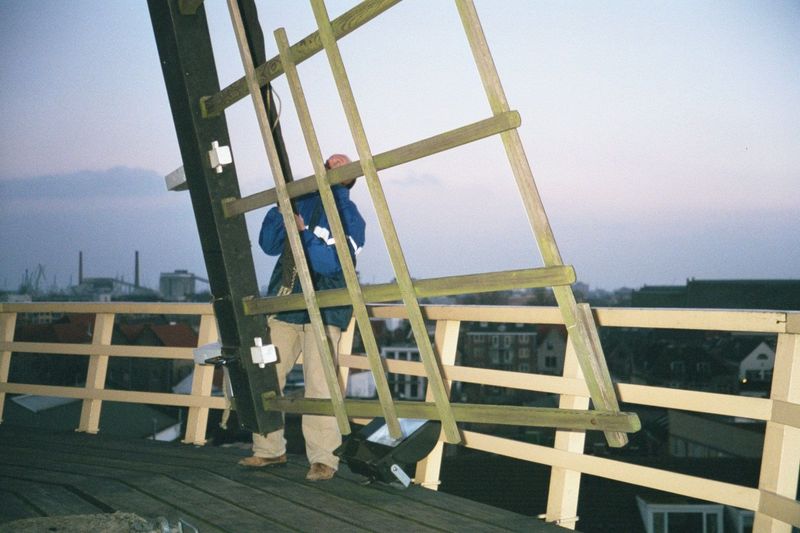He just brought the whistling, 35-foot arms to a halt with a mechanical brake, and he's bunching the sail on this one.