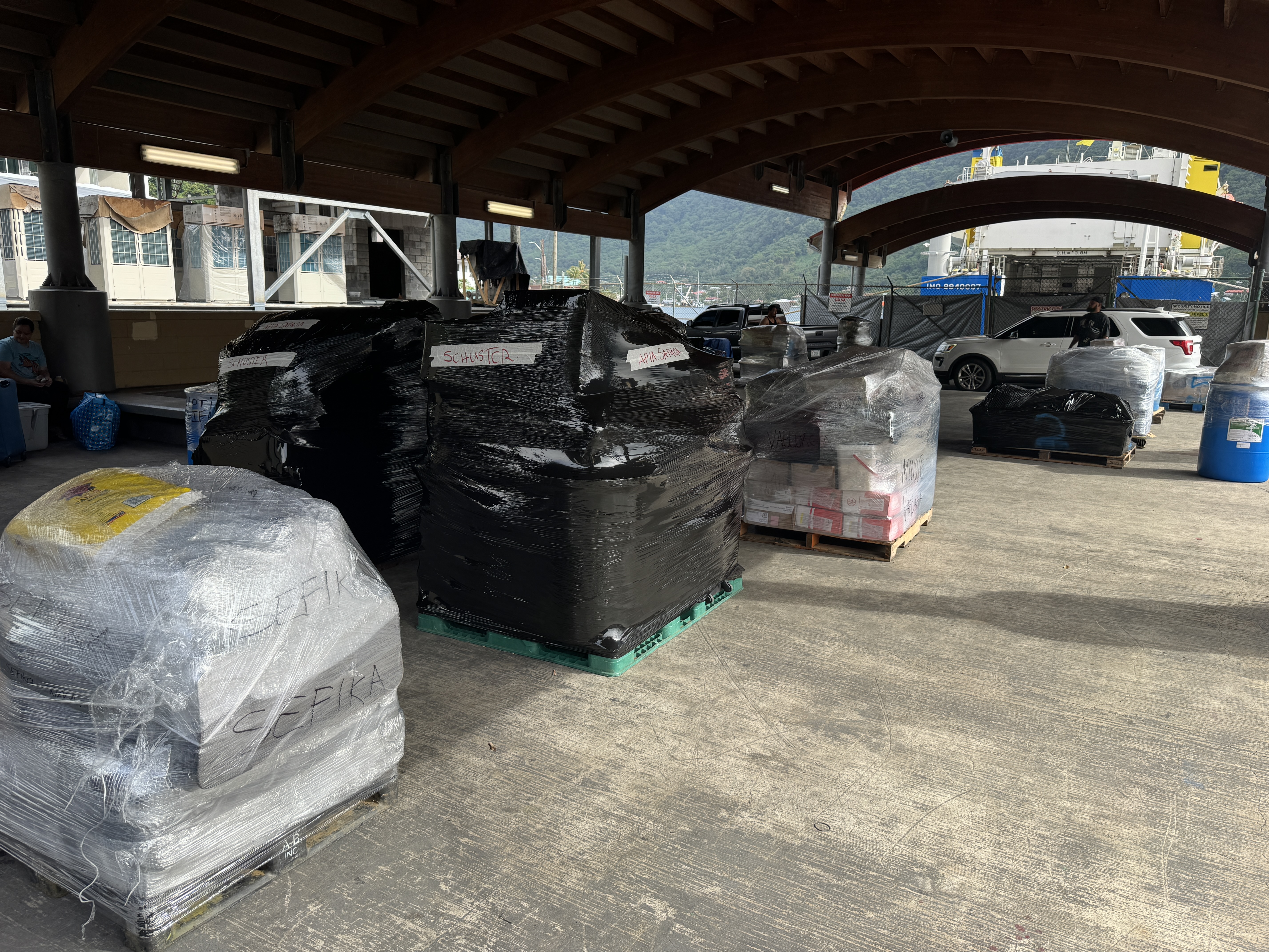 If you want to get on the water,  your best bet is the ferry to Apia.  Here, freight awaits loading.