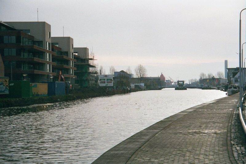 The canals inside the old city of Delft are hardly used commercially any longer, but the Schie canal downstream from the Kolk is very much a