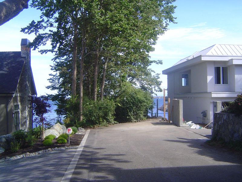 The public beach access path was now pinched between two new houses. The house that had been moved had been on the left here but not so clos