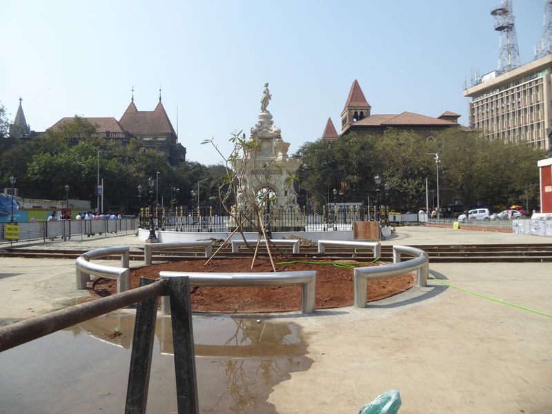 We've come west one block to the Flora Fountain of 1864. It sits on the site of Bombay Fort's Church Gate, demolished in 1860. The location 