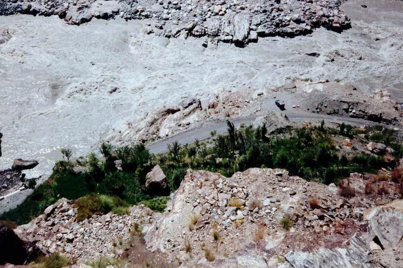 Looking down to the silty Indus from the channel at this point.