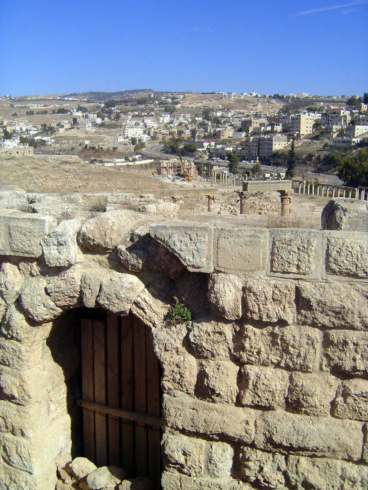 We're north of the Temple of Artemis and overlooking the back of the North Theater. The columns behind its stage are visible, as is the card