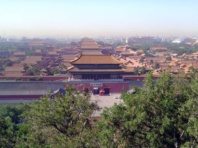 From the summit, the view south shows the line of halls and gates stretching back along the axis of the Forbidden City, as well as the more 