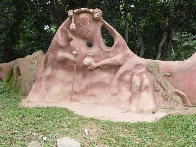Here the wall takes the form of a Yoruba masquerade, one of the masked and costumed figures used in Yoruba ceremonies.