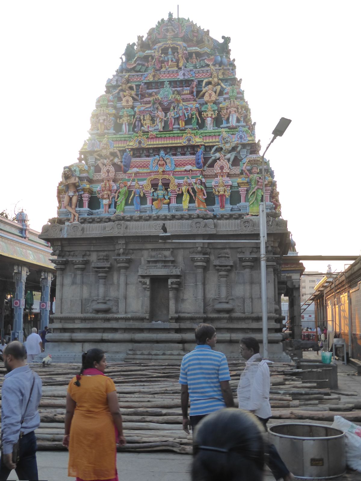 A smaller gopura stands naked on the west side.