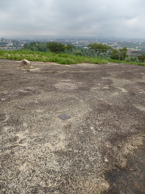 Climbing Aso Rock is out of the question, but here's one that's easy: Katampe Hill. The brass monument is said to mark the geographical cent