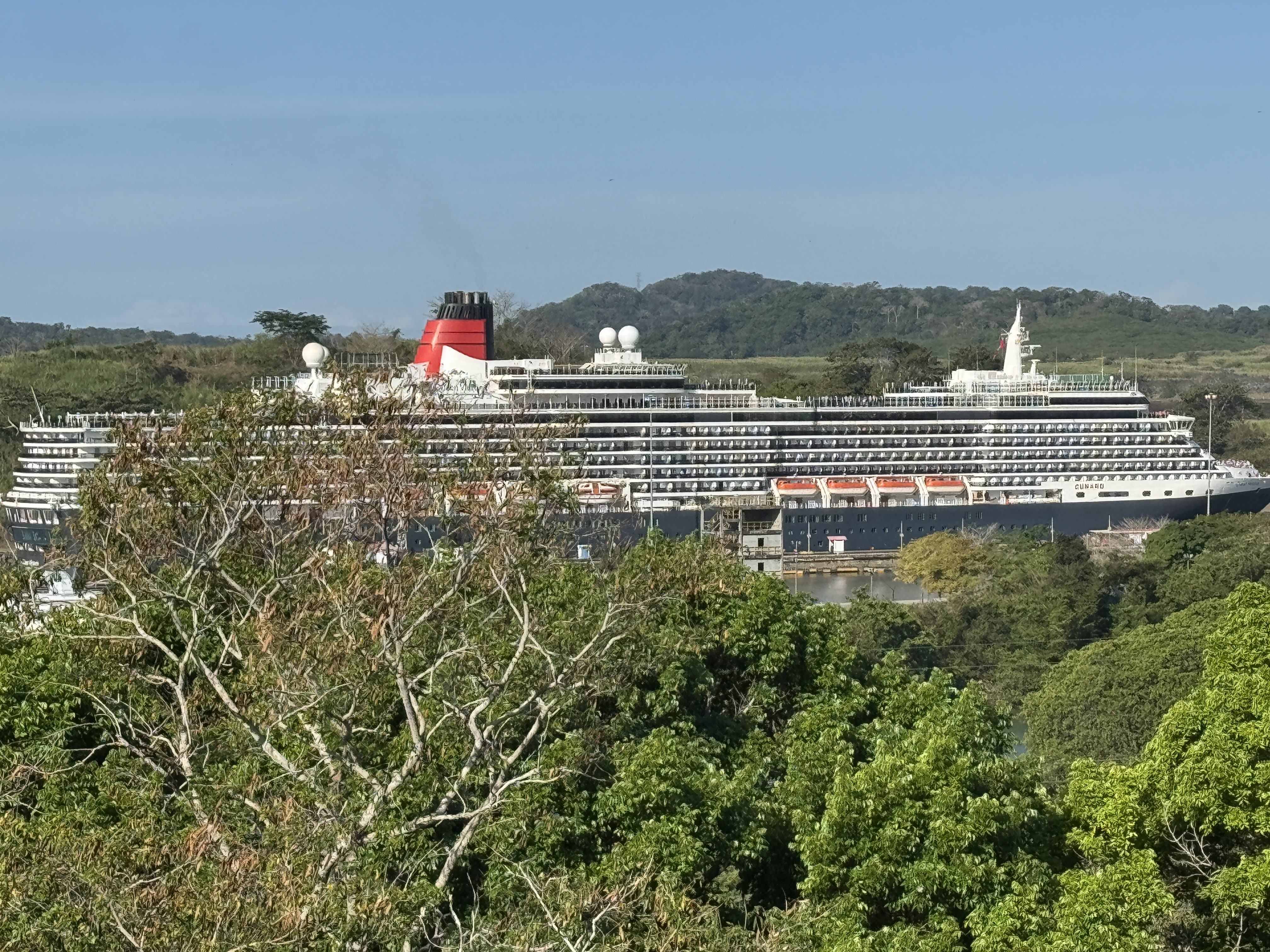 Yikes! We're about four miles from the Pacific Ocean.  This can't be real, you say, but it is: a Cunard Queen approaches the Miraflores Lock