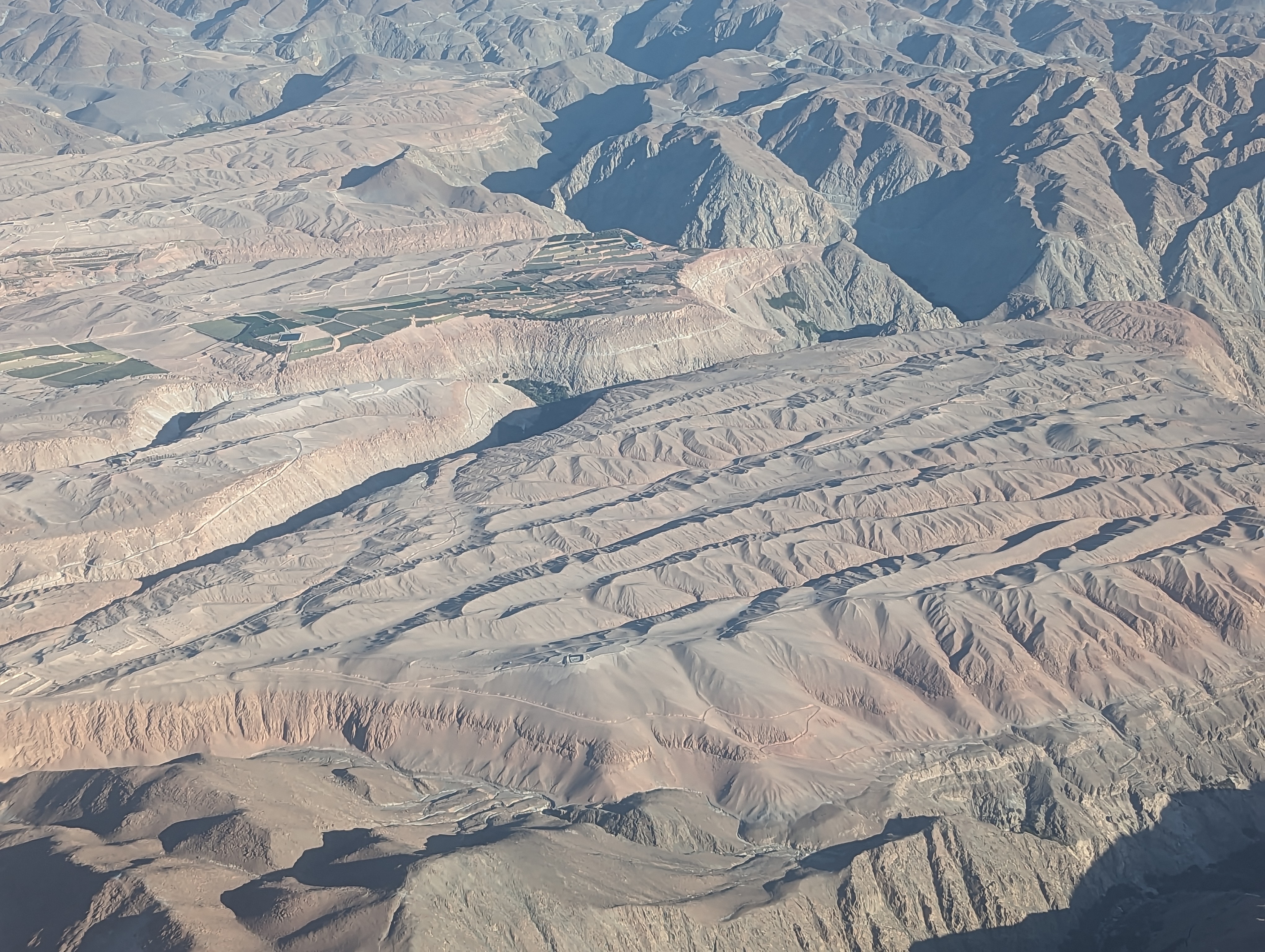 The approach to Arequipa from Lima.   The coast is dry as a bone, but wherever water comes down from the Andes, somebody catches it.