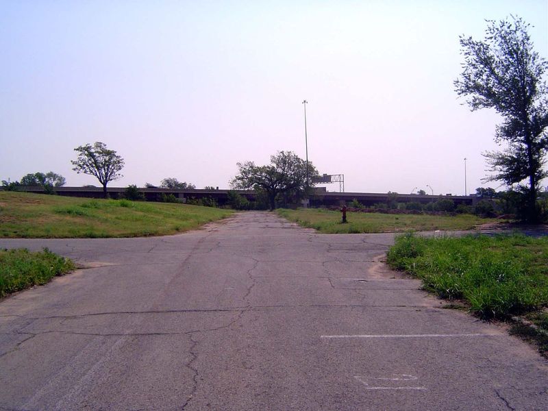We've come over to the west side of the freeway and are looking east along 1st street toward the interstate. Ralph Ellison was born in a roo