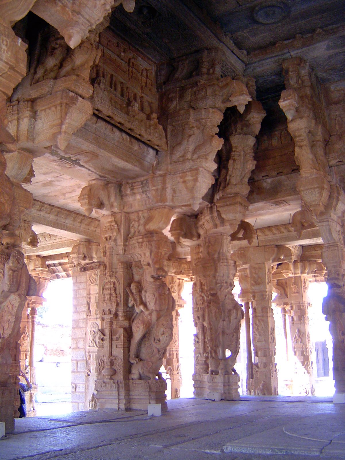 A good view of a mounted yali astride a kneeling elephant. In fact two yalis are stacked, one above the other.
