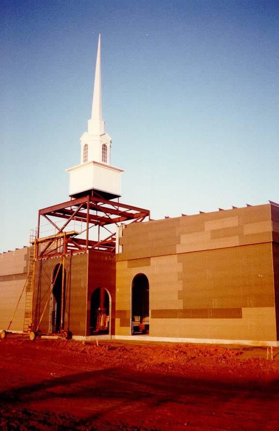 Here, on the east side of town, a church is topped out. After all the clocktowers of the previous pictures, you should be inured, but are yo