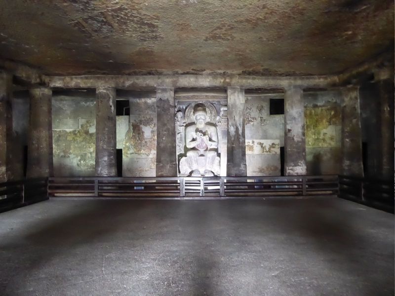Although there are residential cells on the sides of the cave, a shrine has been added, along with a peristyle of interior columns.