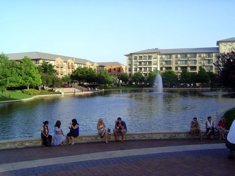 The pedestrians have spilled over from the mixed-use development behind the camera.