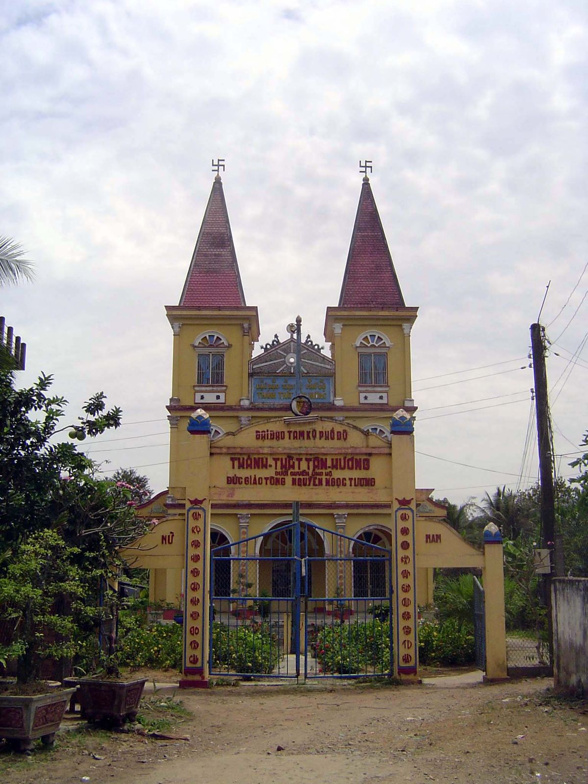 What on earth? It's a Cao Dai or "High Place" church at Tien Giang. The church was founded in Vietnam in 1926.