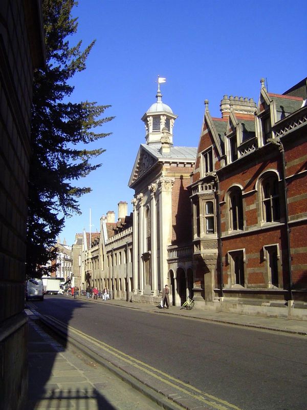 Continuing north: on the right are the Red Buildings of Pembroke College, designed in the 1870s by the prominent Alfred Waterhouse. Beyond t