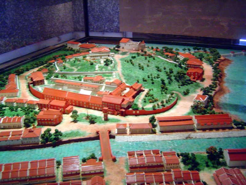 A model of the British period adds the clocktower and a governor's house at the top of the hill but removes the wall. Safe in Penang and Sin
