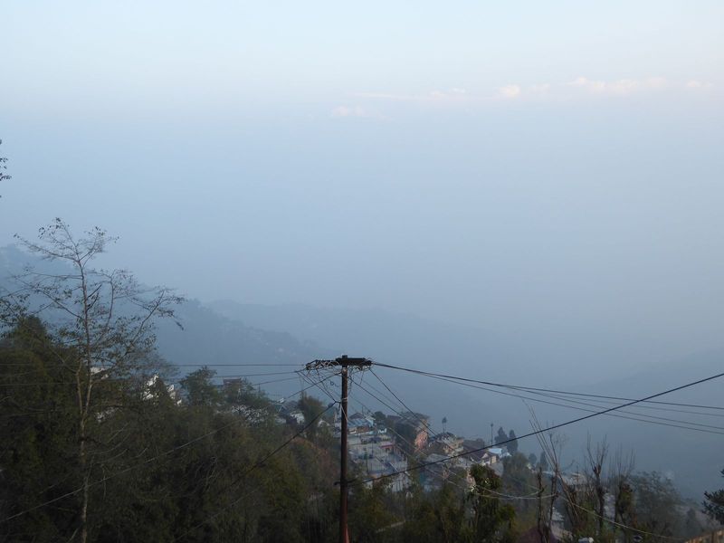 Coming down the hill, what do we see? Straight above the pole, there, about where the sky lightens! It's a mountain, not a cloud. Tell me th