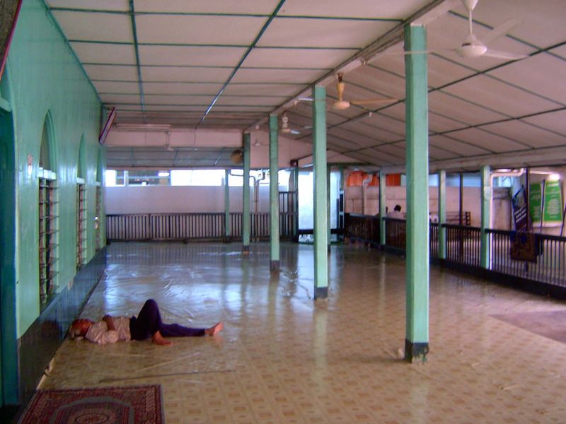 The prayer area, deep within a block of shophouses.