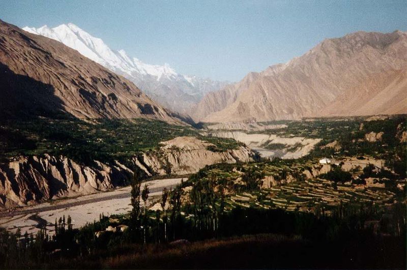 The Hunza River flows south past irrigated terraces in the center of Hunza. Rakaposhi is the huge mountain in the background; the sore thumb