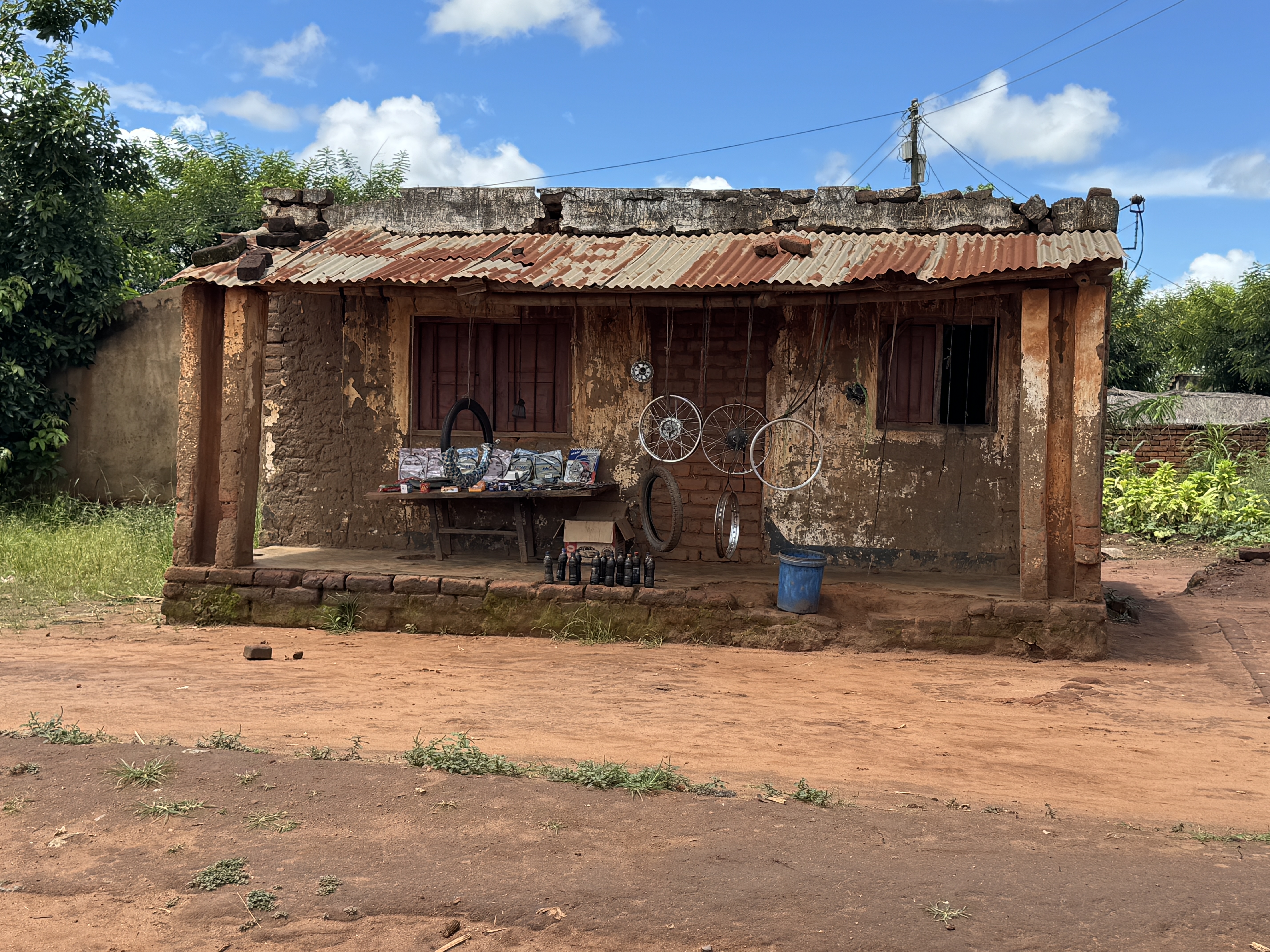 Bike repair shop, with bottles of recycled motor oil for motorbikes.