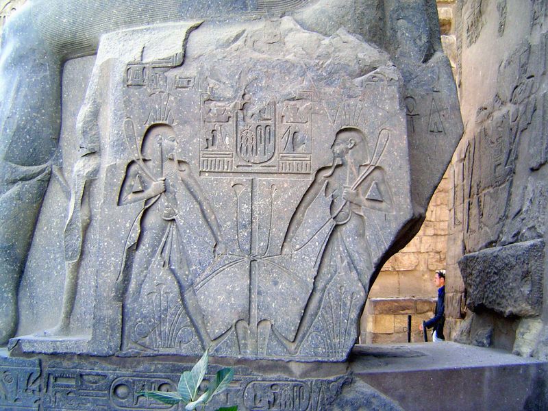 They are the Nile gods, physically tying together Upper and Lower Egypt.