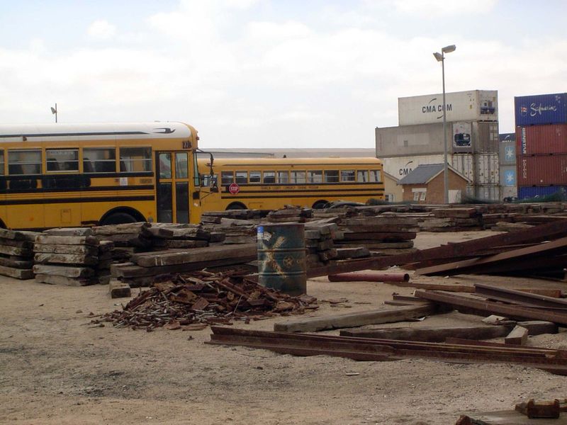 Crossties, rails, and surplused American school buses.