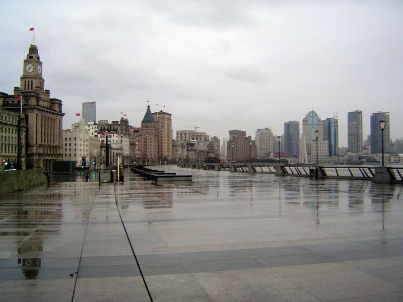 The view downstream and along the Bund, which must have one of the widest sidewalks in the world. Familiar faces: the Custom House, with the