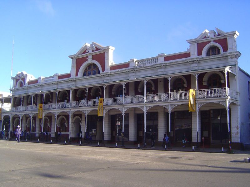 A closer view. At the time of the building's construction, the railroad had not yet made it to Bulawayo, so the iron work had to be carted i