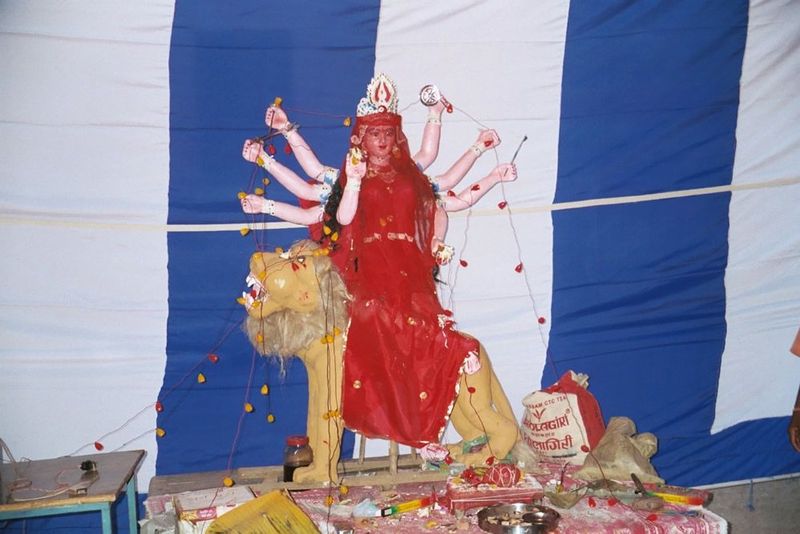 Behind them, the goddess Durga rides her lion. You could not find a village hereabouts that did not have a similar statue to mark the Durgap