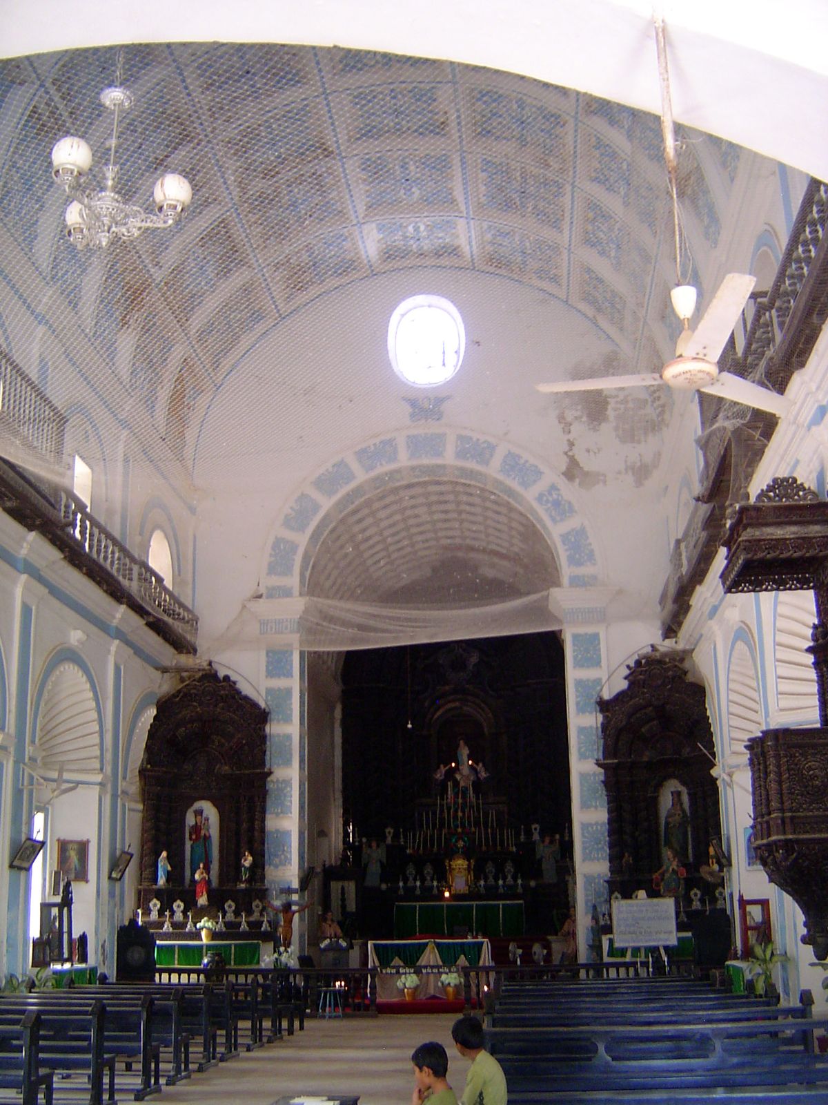 Like so many Jesuit churches, there are no aisles, no waste space in a church designed for as large a congregation as possible. The blue tri