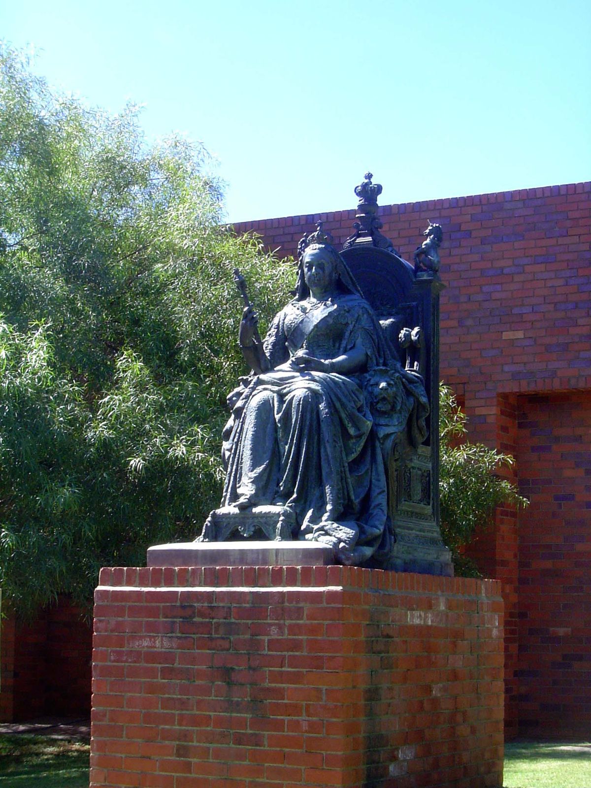 This statue of Victoria was unveiled in 1906 in Queen's Park, but it was later moved to this secluded corner near the museum. That's politic