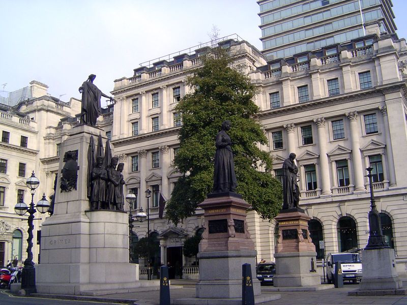 The statue in the foreground is Florence Nightingale, first prominent for her work during the Crimean War, memorialized behind her. To her l