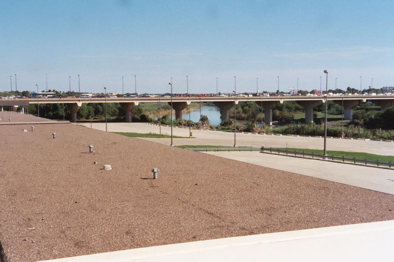 It's that border that makes Laredo. The bridge is International Bridge No. 2; the parking lot is now closed but once was for truck customs. 