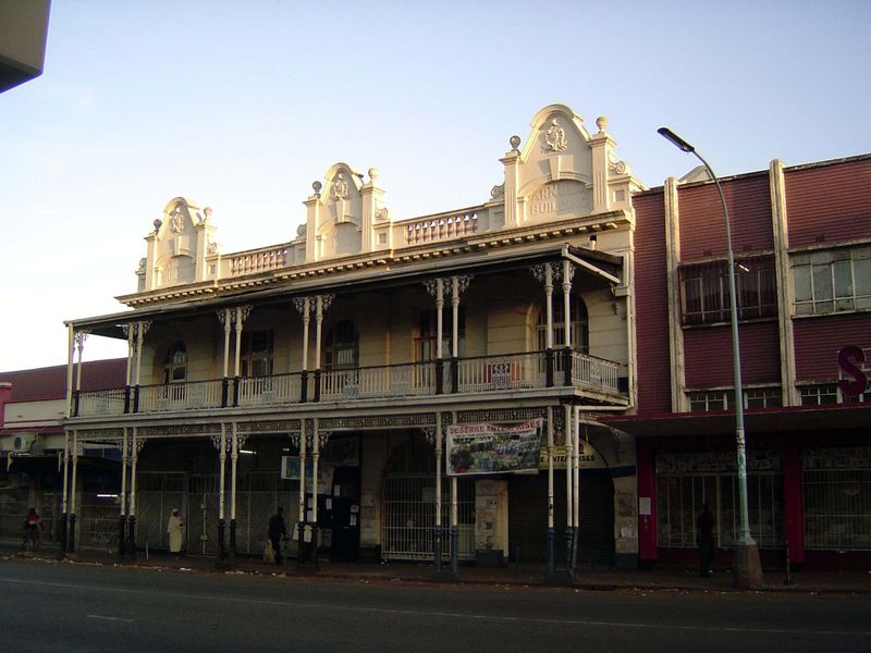 A closer view of the Arnold Building, built in 1910. Arnold used only the left half and lived upstairs. The ironwork came from Durban.
