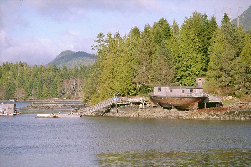 A close up of the far side of the inlet: houseboat and dock.