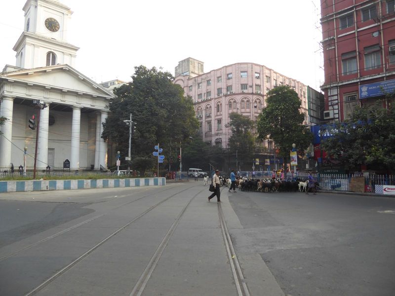 A disused tram line no catenary is pretty good proof rounds the curve at the northeast corner of the square and heads into Lalbazaar, a comm