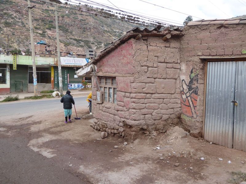 What happened? We've regrouped back in the elegant ambience of Urubamba. We're on our way back to Pisac but have stopped dead here. See why?